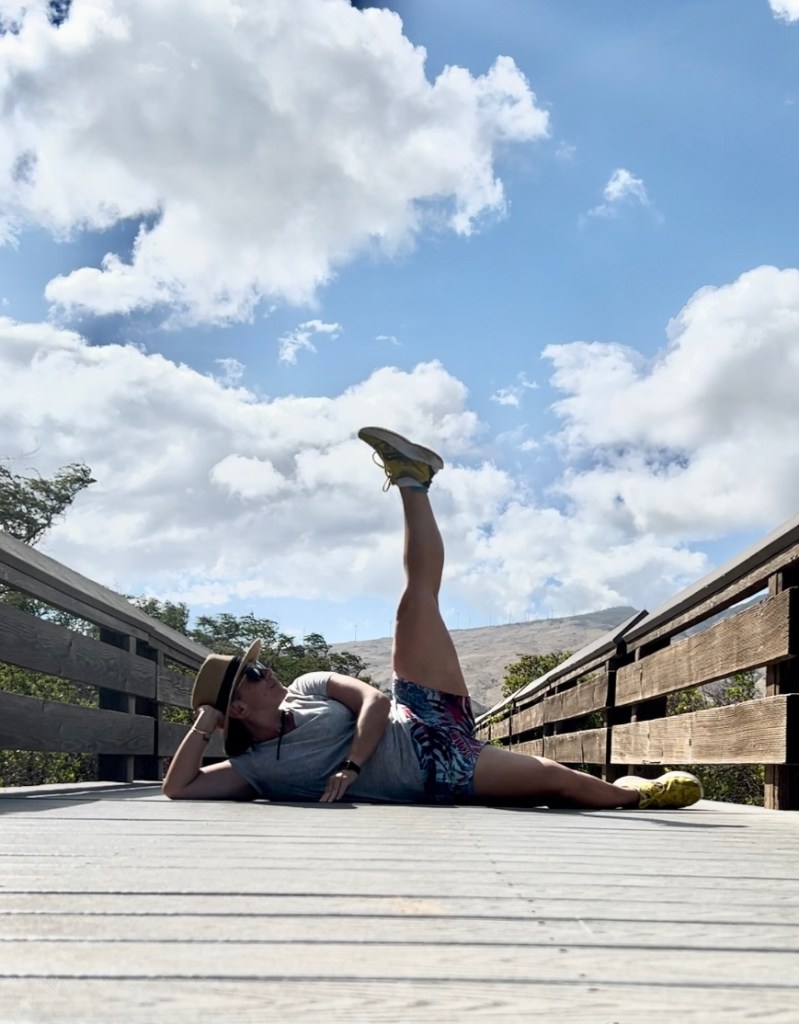 Autumn playfully lounges on the boardwalk at Kealea Pond National Wildlife Refuge